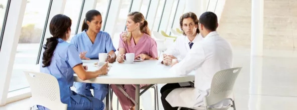 Hospital staff taking a lunch break drinking coffee and tea