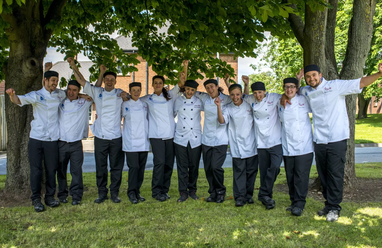 A group of Elior's chefs celebrating outside